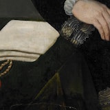 Detail uit het schilderij van Willem van Oranje. Op een tafel ligt een document met een aanhangend zegel van rode was. Rechtsboven in beeld is een hand zichtbaar.