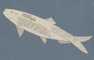 visvorm uitgeknipt uit papier beschreven met zwarte inkt